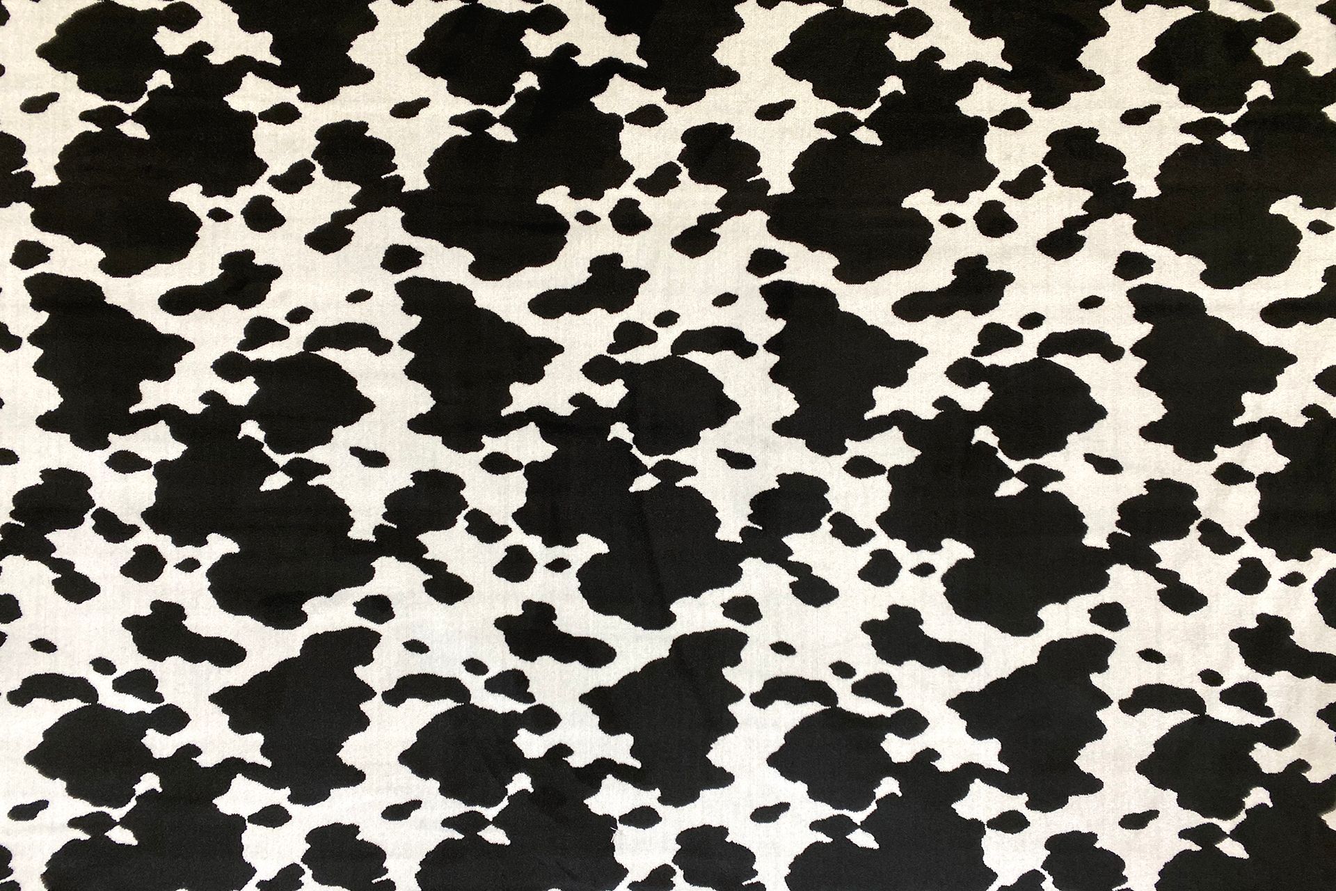 Tissu en noir et blanc comme le pelage d'une vache