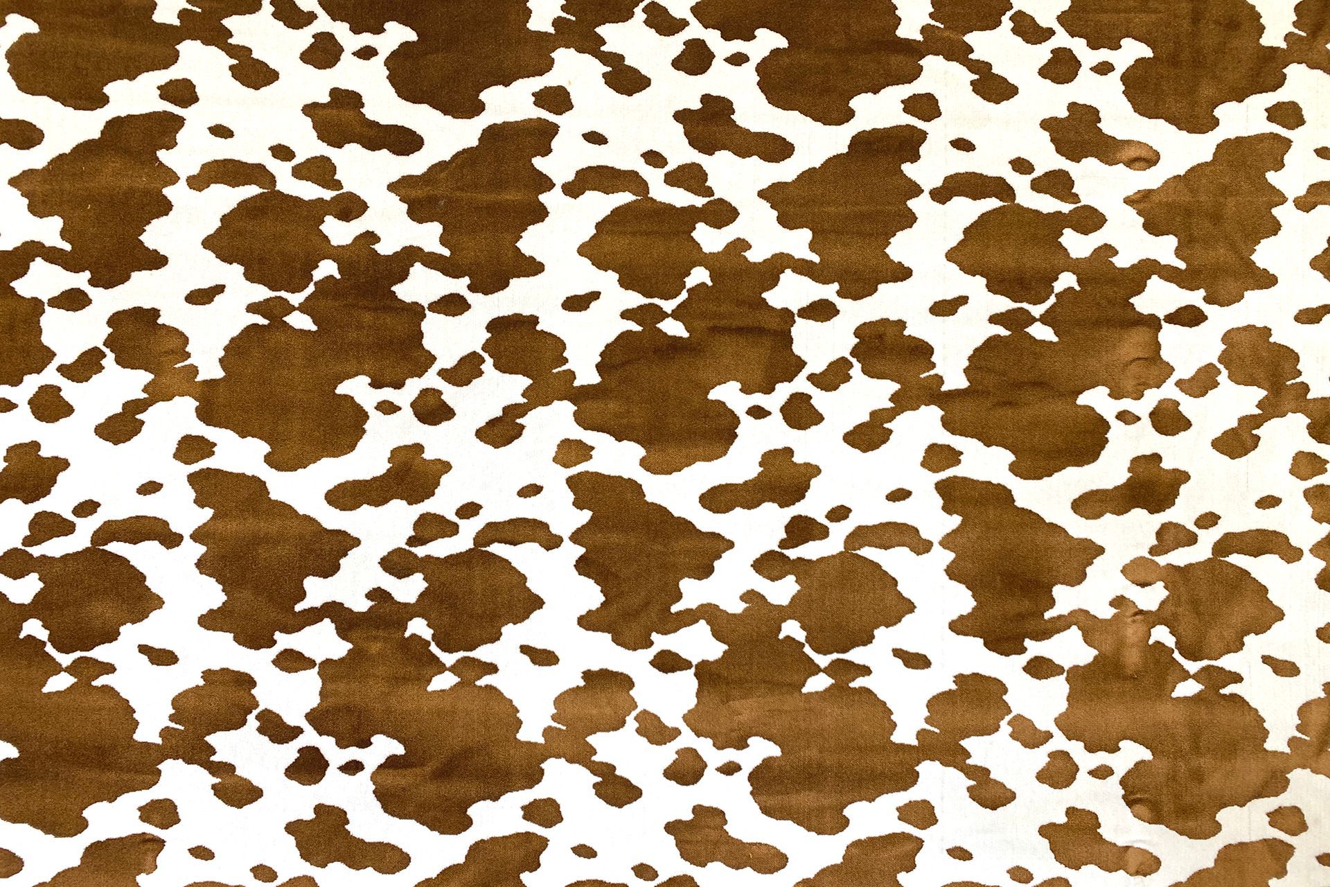 Tissu blanc et marron comme le pelage d'une vache