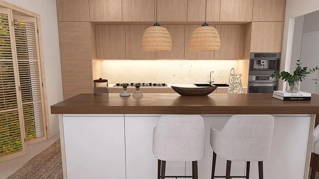 Una cocina con una gran isla y dos taburetes.