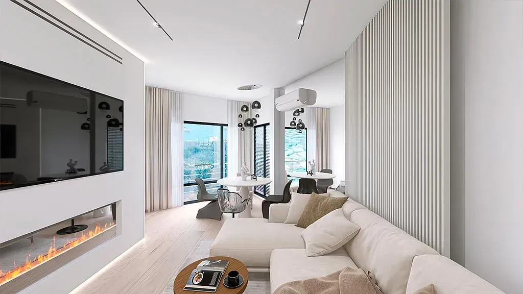 Una sala de estar con sofá, chimenea y televisión.