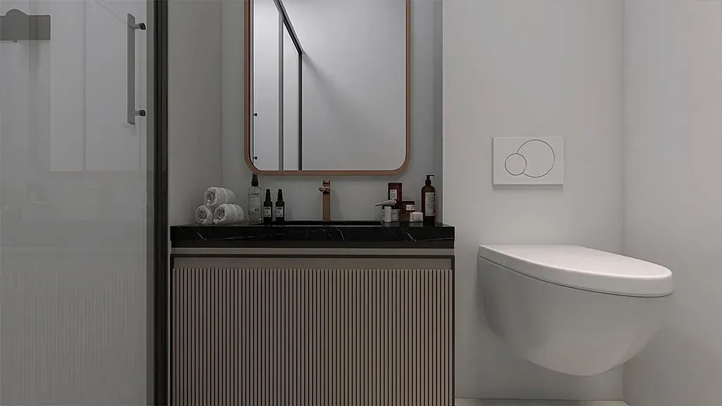 Un baño con lavabo, inodoro, espejo y ducha.