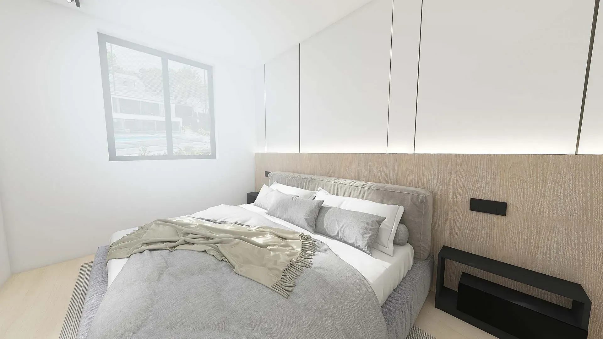 Un dormitorio con una cama, mesita de noche y ventana.