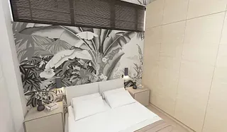 Un dormitorio con una cama, mesitas de noche y un mural en la pared.