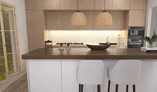 Una cocina con una gran isla en el medio de la habitación.