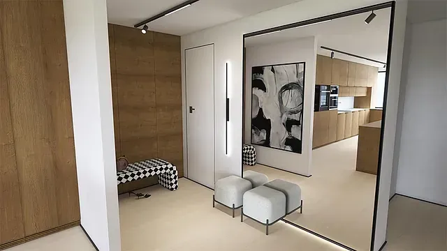 Un pasillo con dos otomanas y un espejo grande.