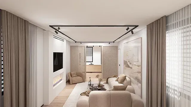 Una sala de estar con sofá, sillón, televisión y chimenea.