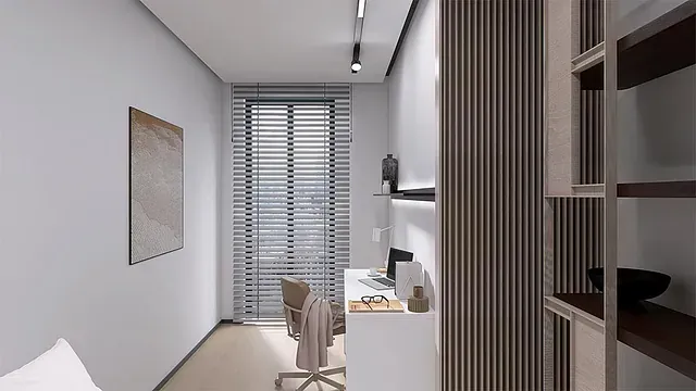 Un dormitorio con un escritorio y una silla.