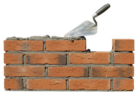 Mur de briques en construction avec une truelle détourée