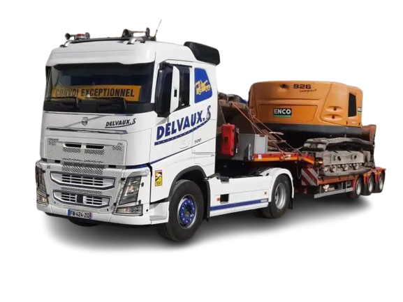 Camion blanc portant le logo DELVAUX transportant une excavatrice sur une remorque.