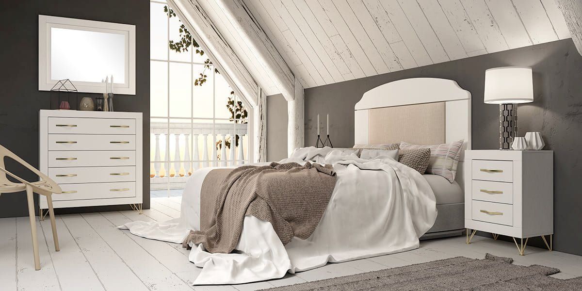 Dormitorio con muebles blancos, paredes grises y luz natural procedente de una ventana.