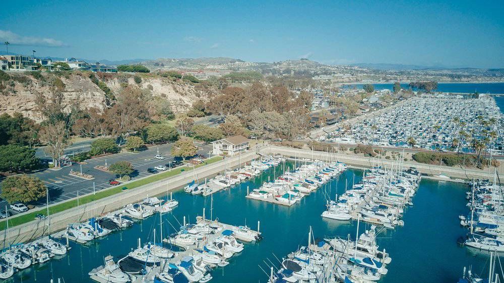 An aerial view of a marina filled with lots of boats.