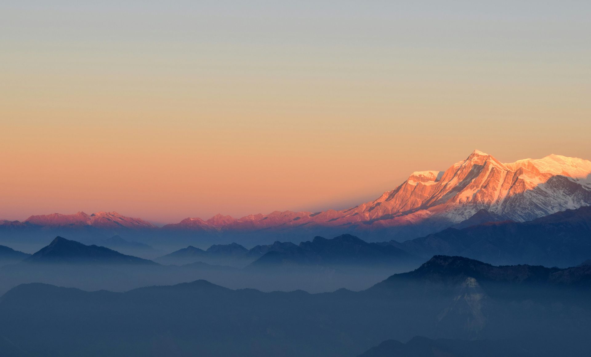 Golden glow on the peaks of Nepal at sunrise