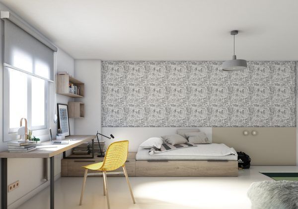 Un dormitorio con una cama, un escritorio y una silla amarilla.