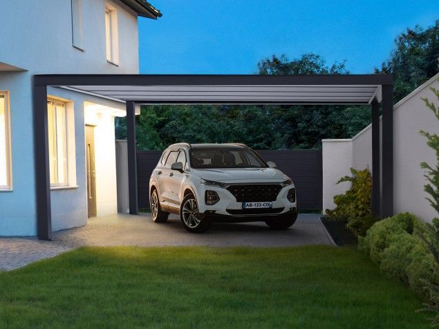 Carport avec une voiture blanche garée dessous