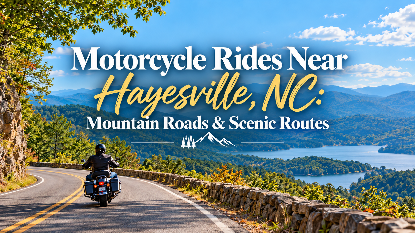 Motorcycle on winding mountain road above Haysville, NC, with lake and blue ridges under a sunny sky