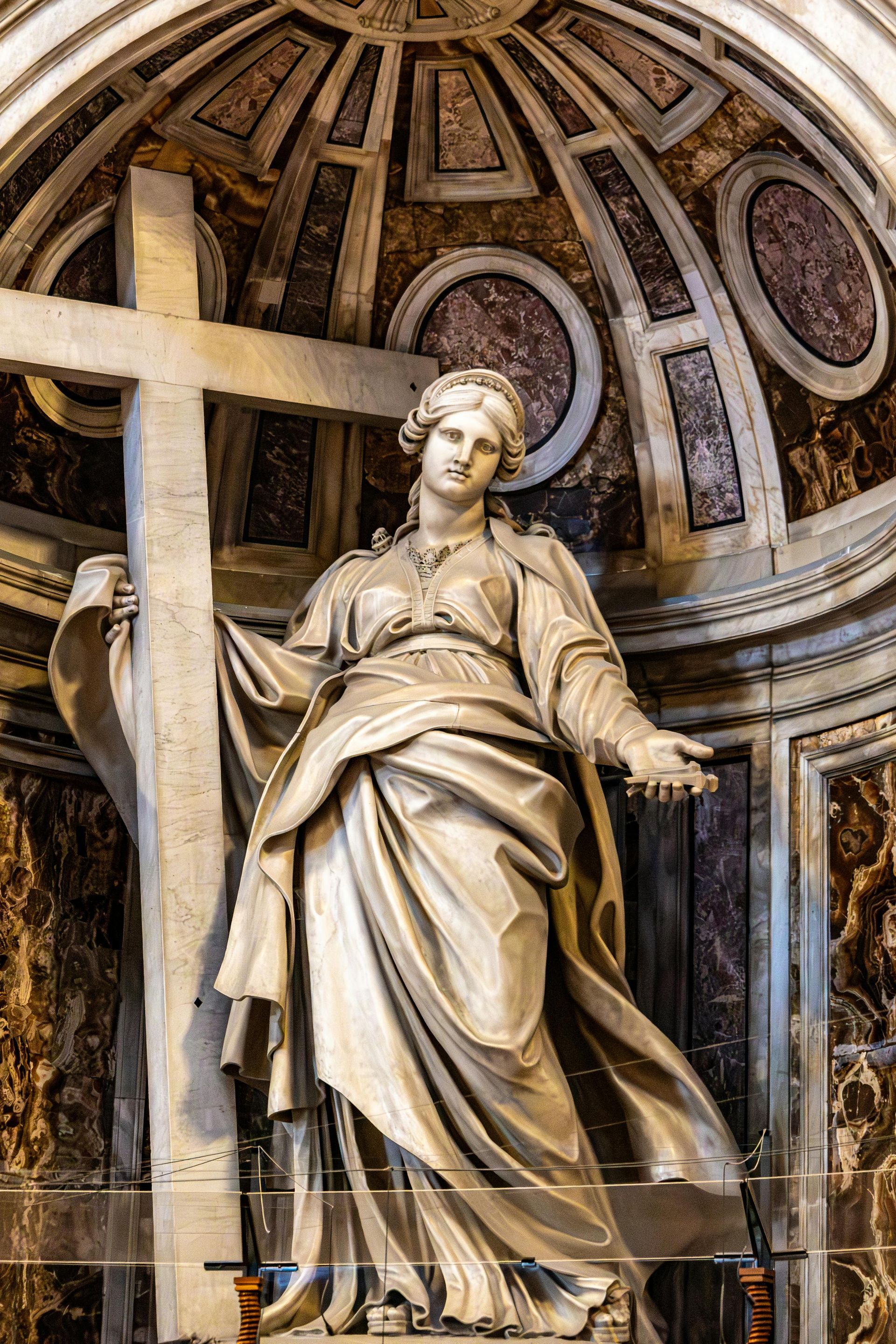 Statue of Saint Helena holding a large cross in St. Peter's Basilica, Rome.