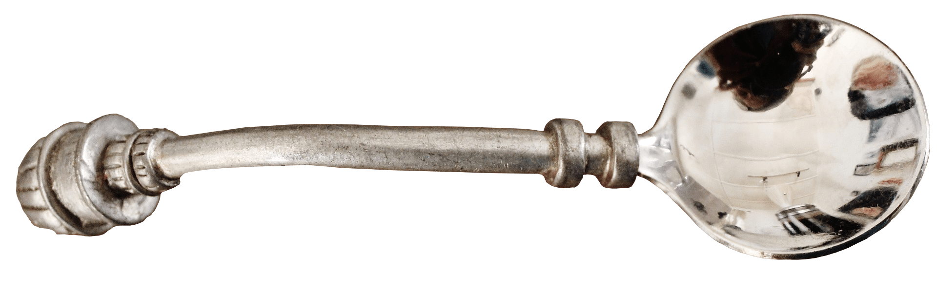 Cuillère en argent avec un manche décoratif.