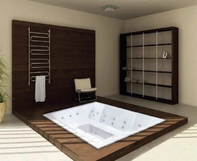 Un baño con bañera de hidromasaje y una silla.