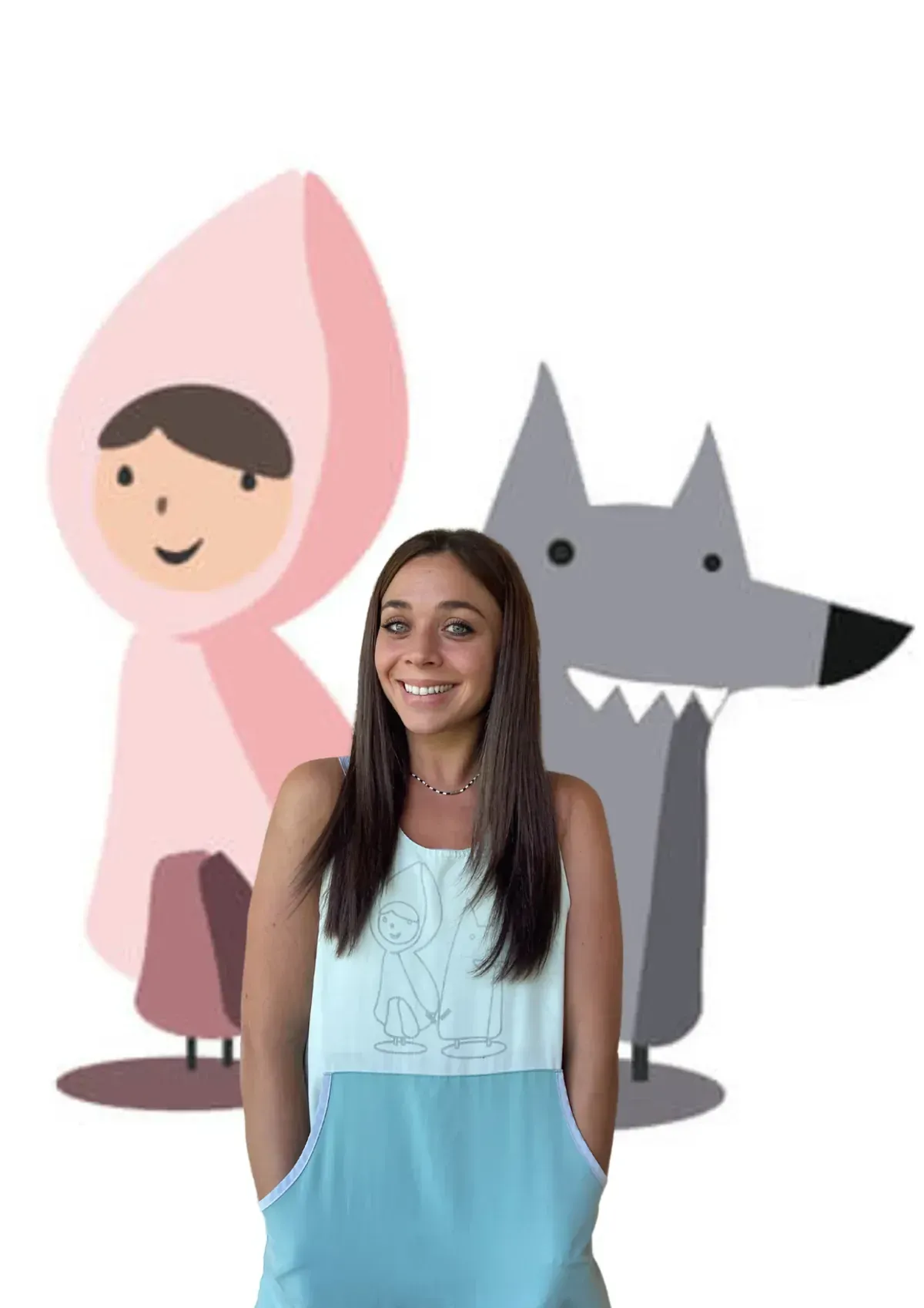 Mujer frente a recortes de Caperucita Roja y un lobo, con un delantal de Caperucita Roja.