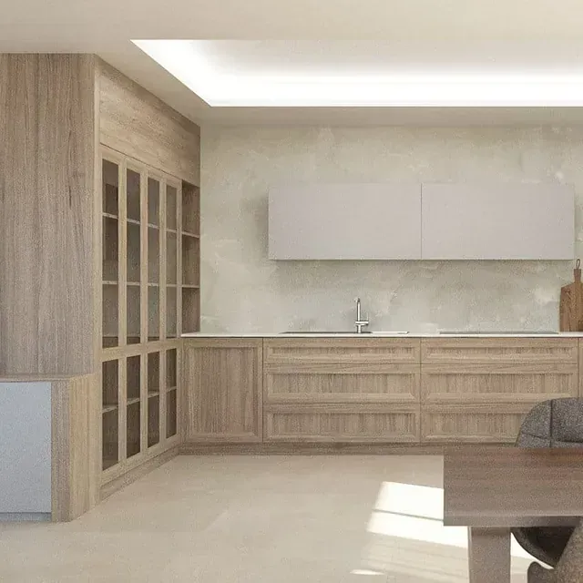 Una cocina con gabinetes de madera y encimeras blancas y una mesa.