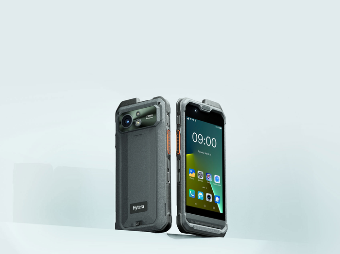 Two phones are sitting next to each other on a table.