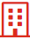 Ein rot-weißes Symbol eines Gebäudes mit Quadraten darauf.