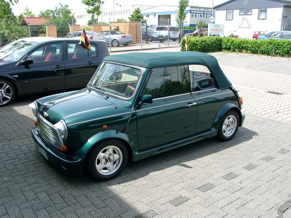 Mini, Verdeckbezug in Sonnenland Stoff grün geliefert und montiert.