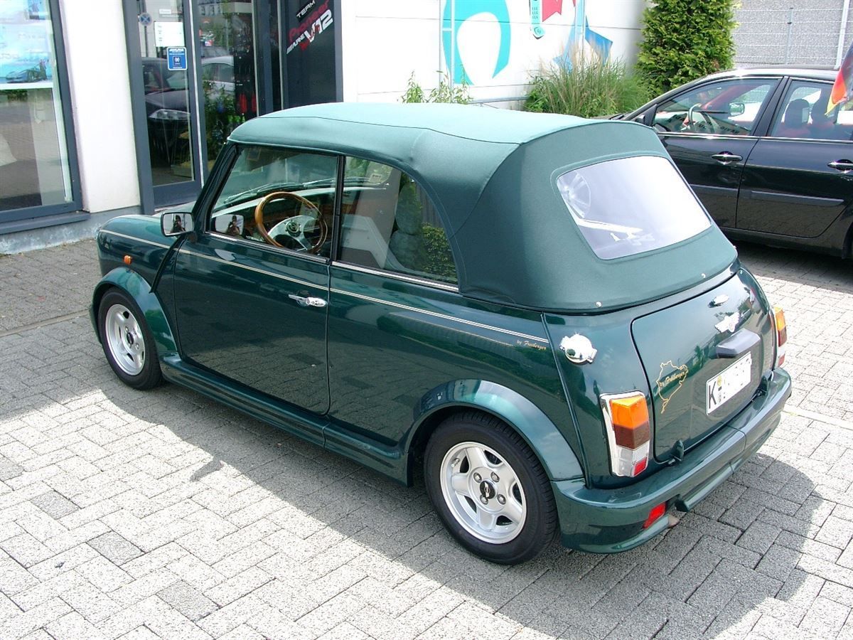 Mini, Verdeckbezug in Sonnenland Stoff grün geliefert und montiert.