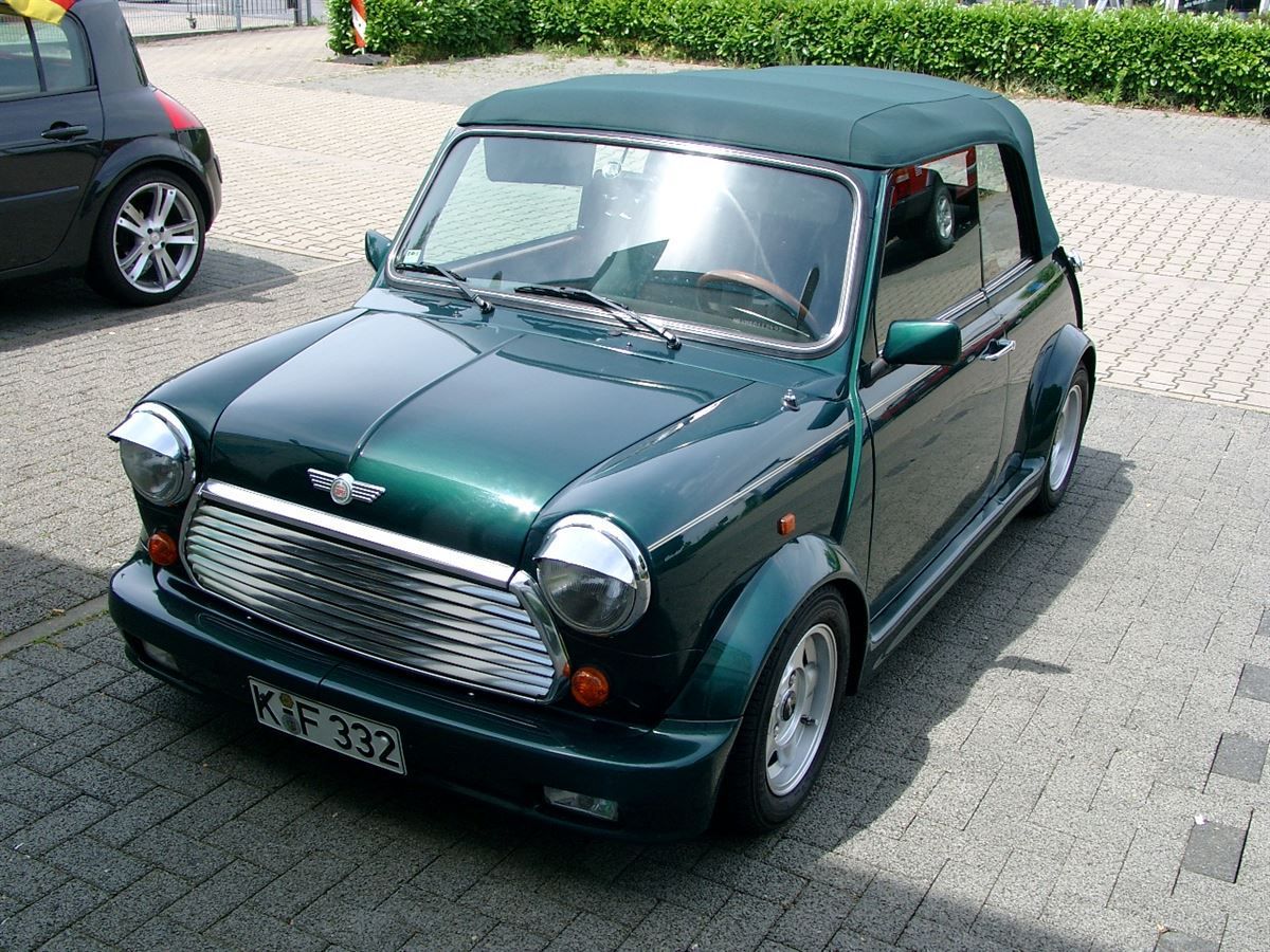 Mini, Verdeckbezug in Sonnenland Stoff grün geliefert und montiert.