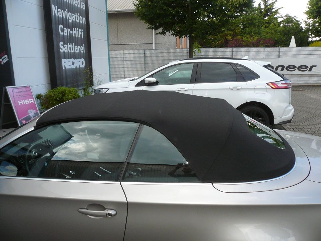 BMW 1er , Verdeckbezug Sonnenland Stoff schwarz geliefert und montiert.
