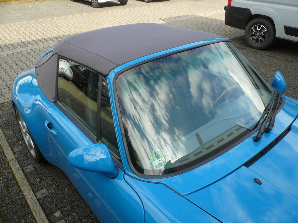 Verdeck Bezug in Sonnenland Stoff classicgrau für Porsche 911 Typ 993 Cabrio Bj. 94-98 geliefert und montiert.