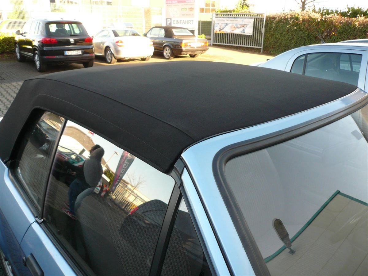 Fort Escort , Verdeckbezug Sonnenland Stoff schwarz geliefert und montiert.