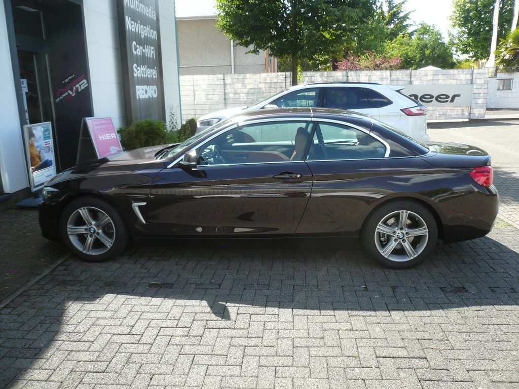 Rückfahrkamera Modul und Griffleisten-Kamera von NAVLINKZ im 4er BMW Cabrio nachgerüstet und auf das NBT2 OEM-System adaptiert.