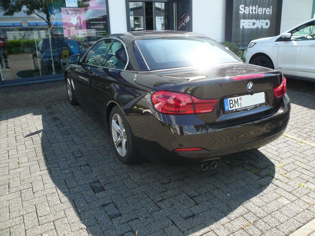 Rückfahrkamera Modul und Griffleisten-Kamera von NAVLINKZ im 4er BMW Cabrio nachgerüstet und auf das NBT2 OEM-System adaptiert.