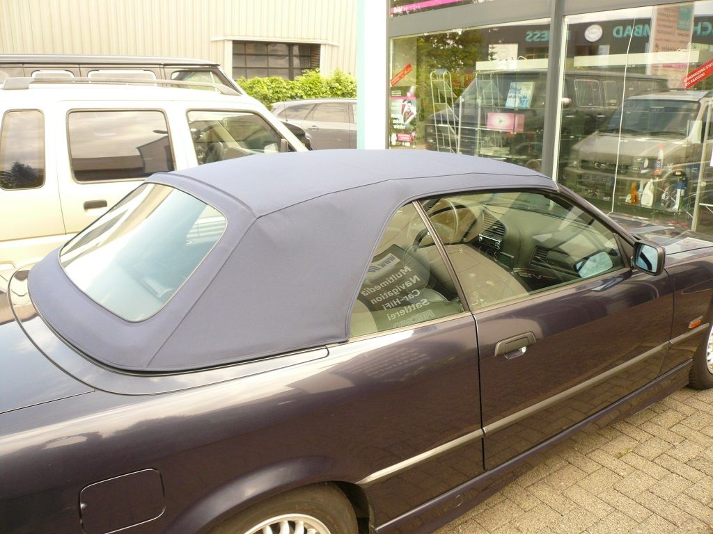 BMW 3er Typ E36 , Verdeckbezug Sonnenland Stoff grün geliefert und montiert.