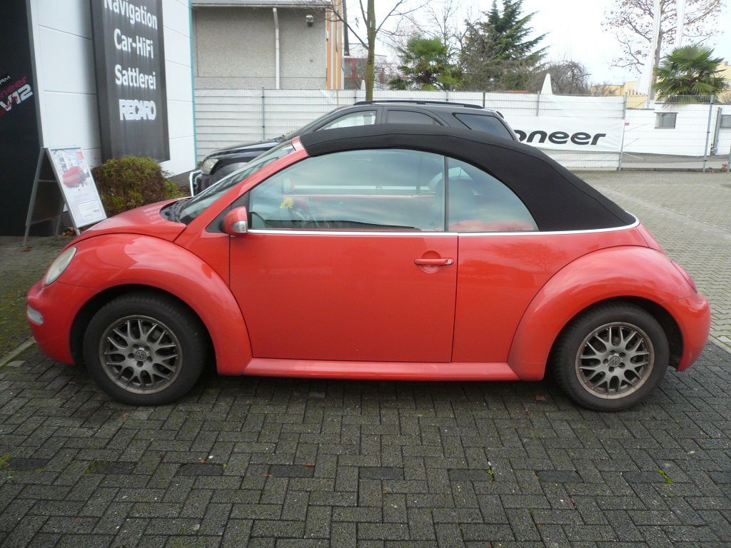 VW Beetle, Verdeckbezug in Sonnenland Stoff schwarz geliefert und montiert.