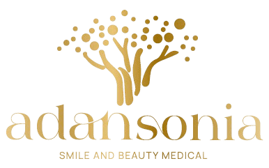 Logotipo dorado: Árbol estilizado sobre la palabra "adansonia", con "smile and beauty medical" debajo.