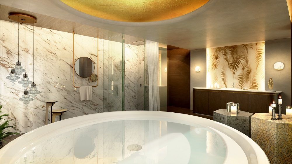 Hay una bañera grande en el medio del baño.