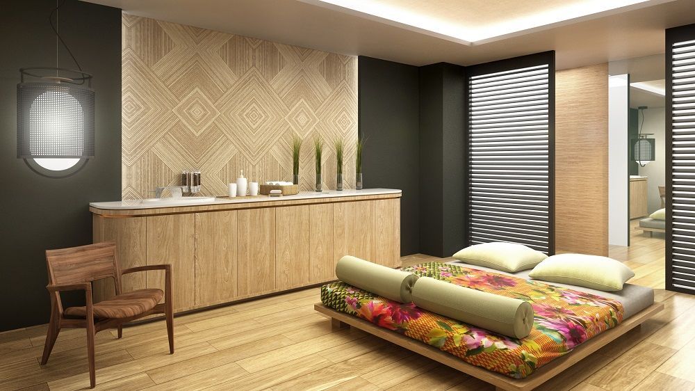 Un dormitorio con una cama grande y una silla.