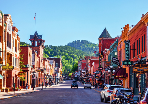 Downtown deadwood on a clear, sunny day with surrounding restaurants and shops