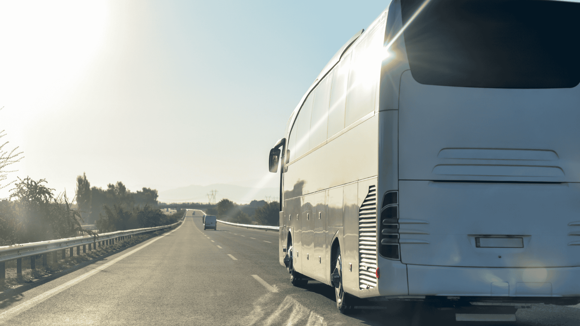 Rear view of bus traveling down a road toward Deadwood, South Dakota