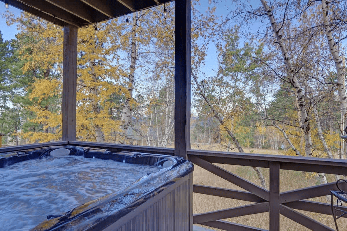 Hot tub overlooking the woodlands at High Ridge Trail Lodge