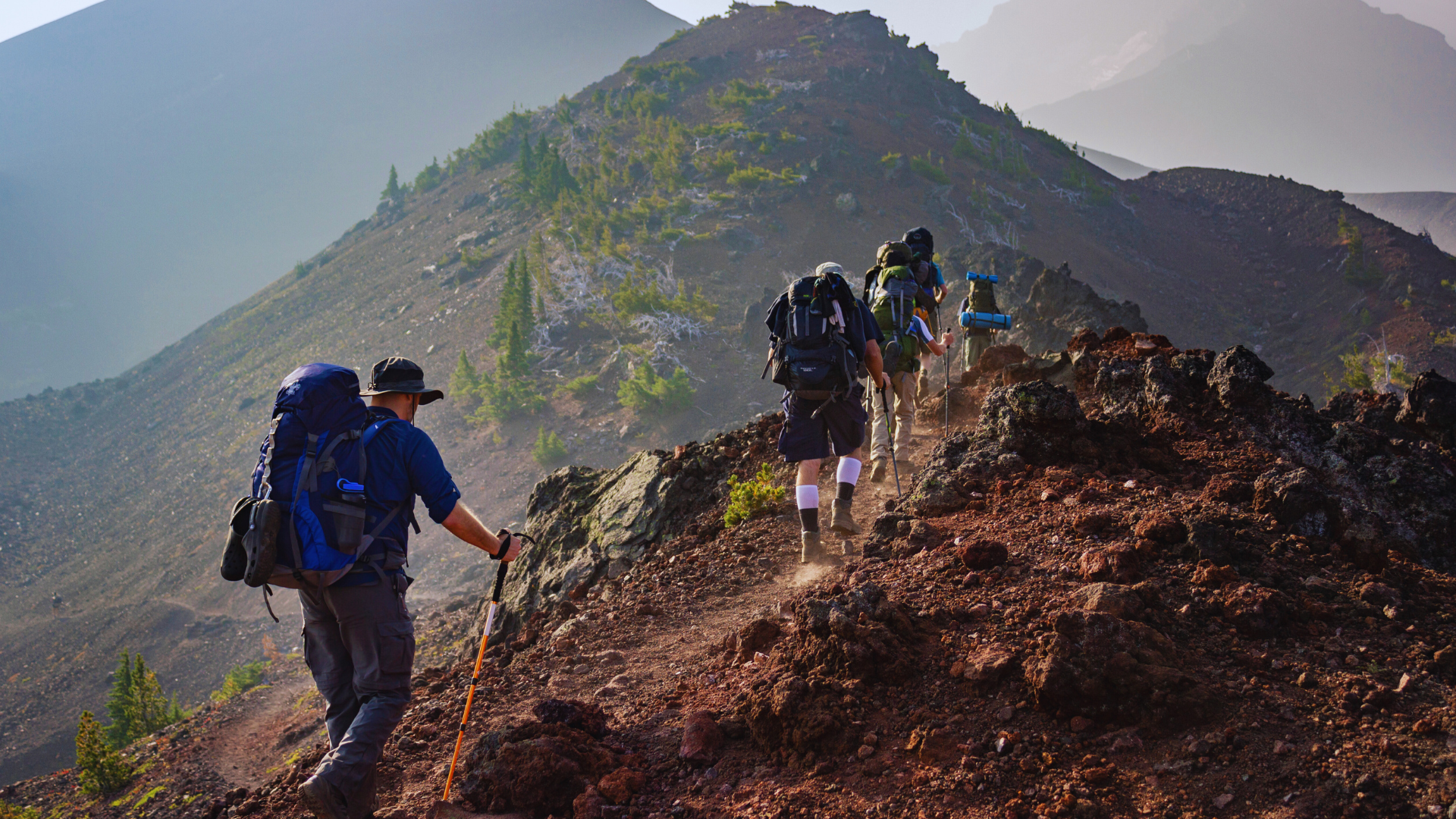 Group of people hiking up rocky hills of South Dakota