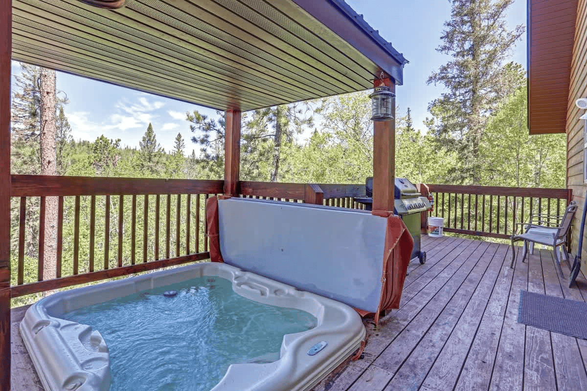 Private hot tub overlooking the mountains at Lookout View Retreat