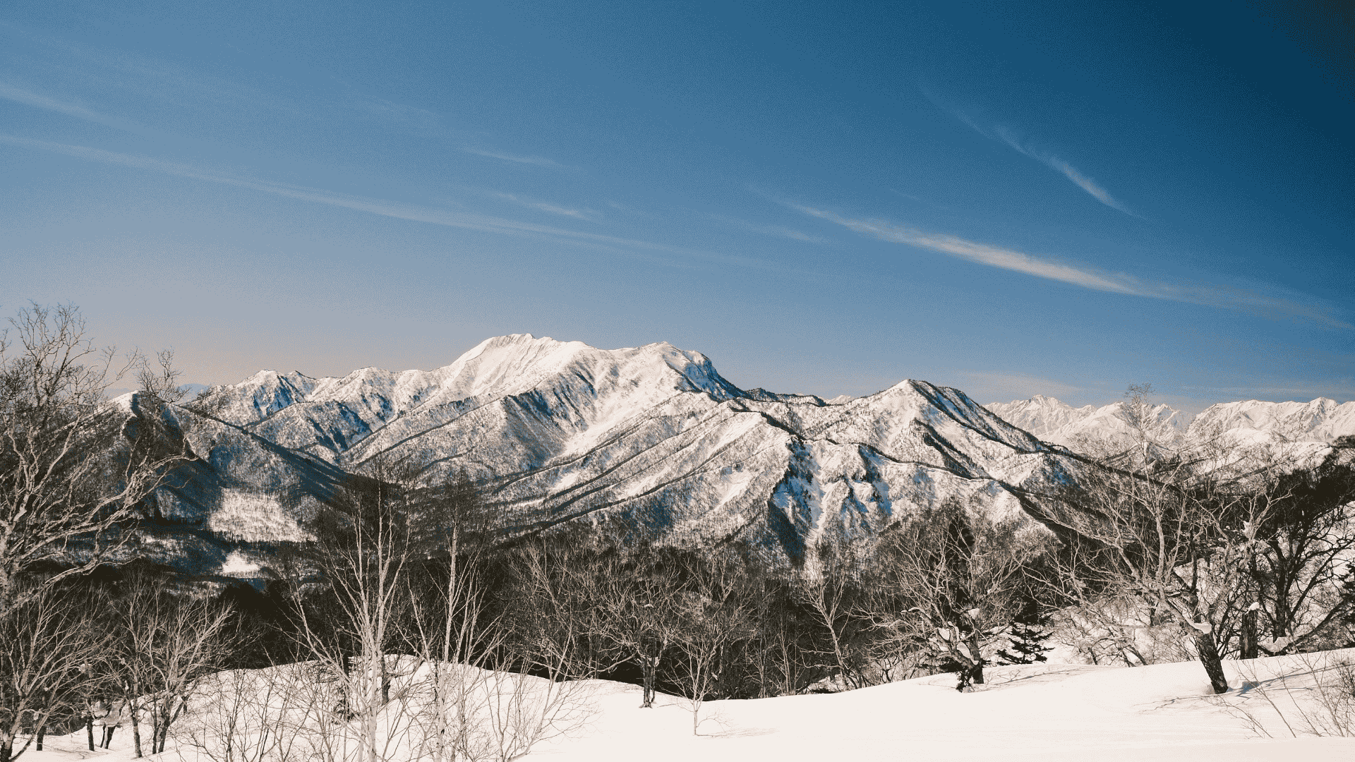 Snowy mountain landscape near Deer Mountain in South Dakota with clear skies and sunshine