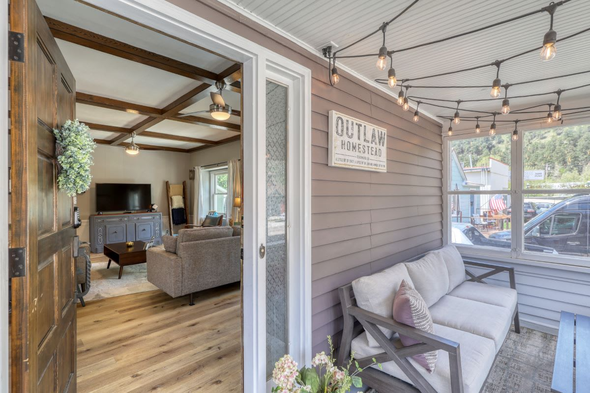 Outlaw Homestead's comfy screened-in patio  in the Black Hills