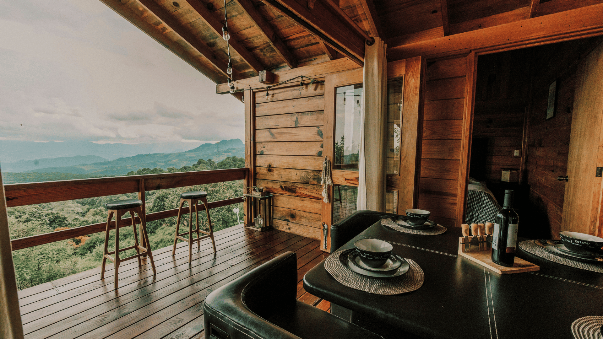 Luxury cabin large outdoor porch overlooking beautiful mountain views