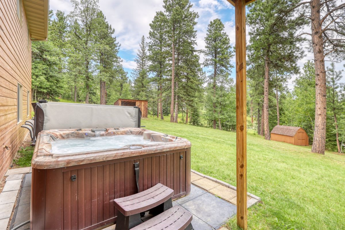 Sunny Days Hideaway's private hot tub overlooking the Black Hills