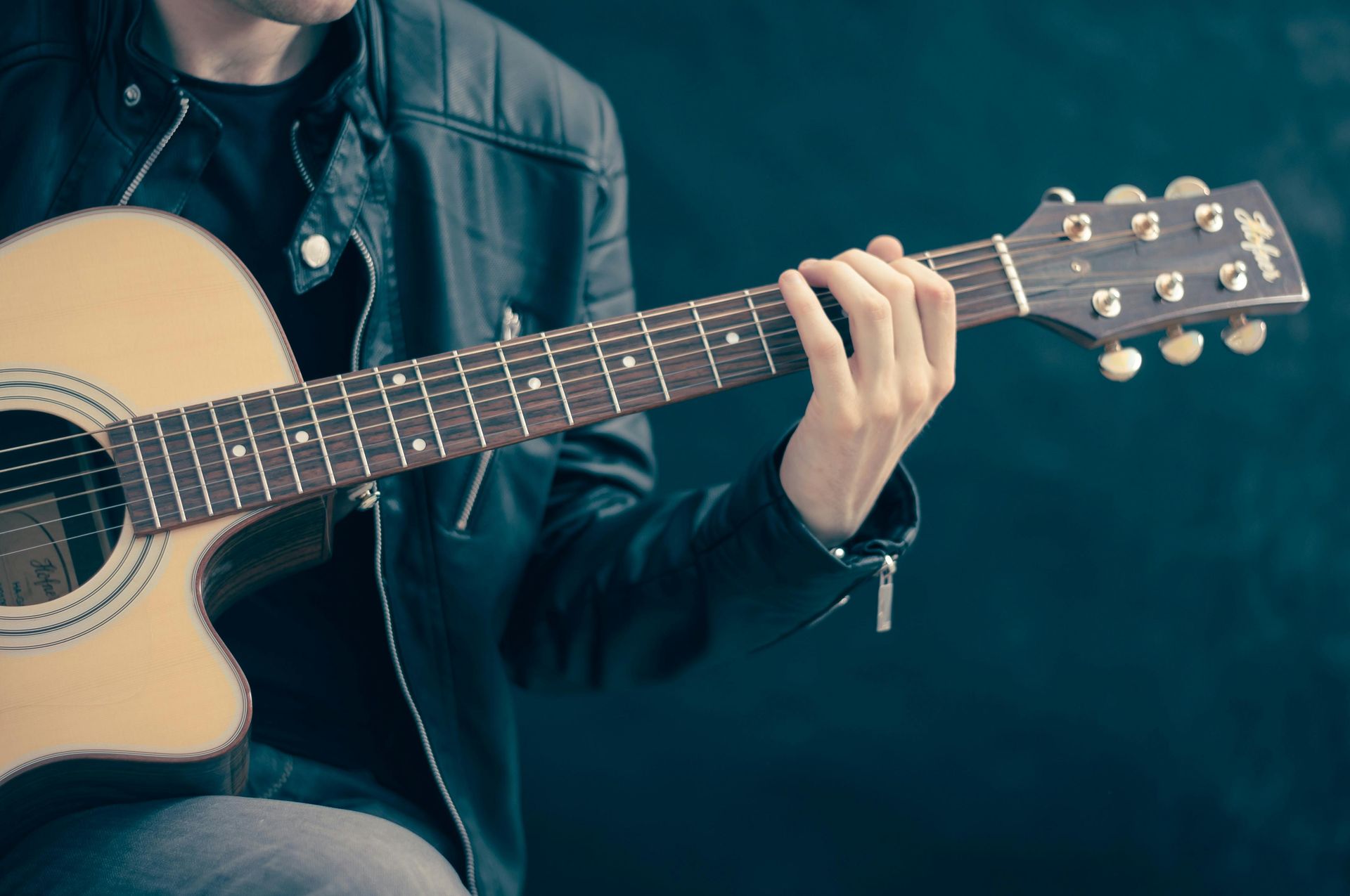 Man playing guitar and performing live music