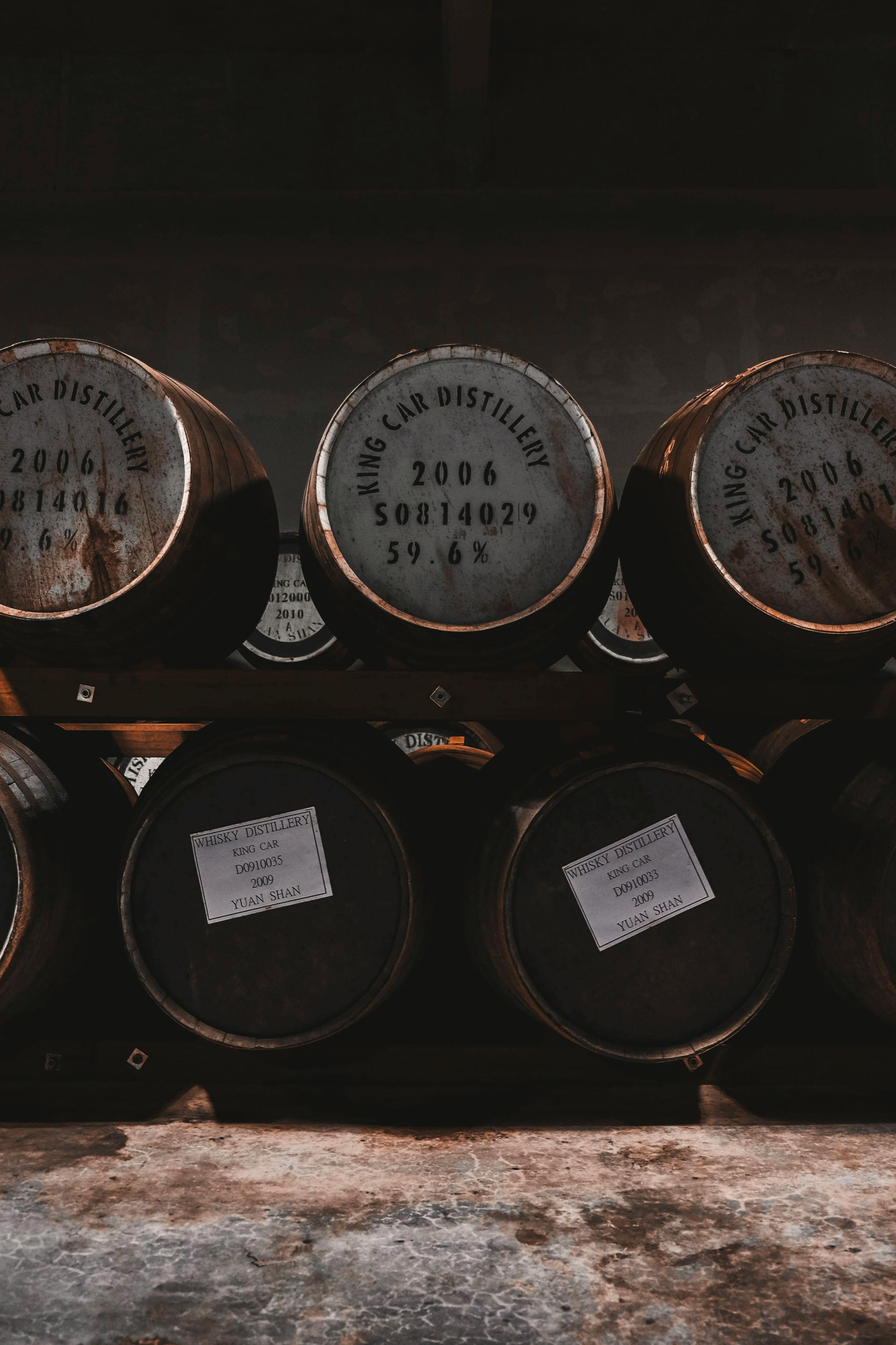Distillery barrels stacked together at a local brewery
